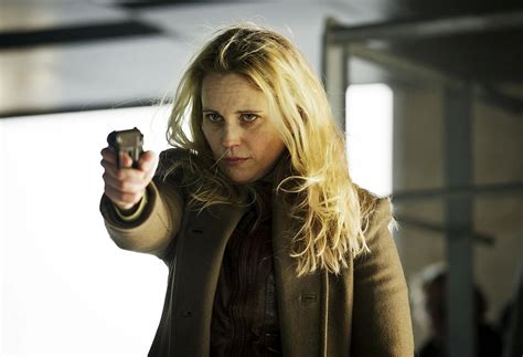 The character Saga Noren holding a gun.
